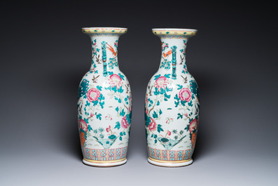 A pair of Chinese famille rose vases with peacocks and phoenixes, 19th C.