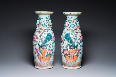 A pair of Chinese famille rose vases with peacocks and phoenixes, 19th C.