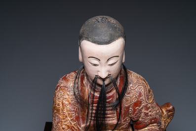 A large Chinese lacquered and polychromed wood sculpture of Guandi, 18th C.