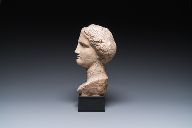 A Roman limestone head of a female, probably Pannonia province, 1st/4th C.