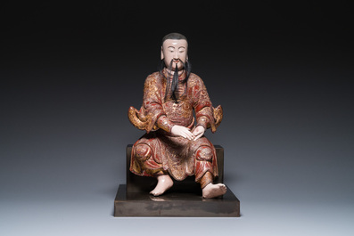 A large Chinese lacquered and polychromed wood sculpture of Guandi, 18th C.