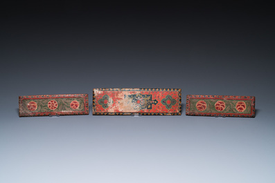 Eight tsaklis and three painted wood book covers, Tibet, 19th C.