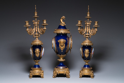 A large three-piece S&egrave;vres-style clock garniture with gilt bronze mounts, France, 19th C.