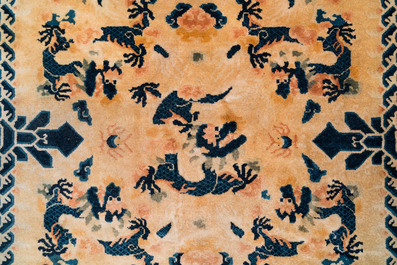 A large Chinese Ningxia rug with dragons on a yellow ground, Tai He Tian 太和殿 mark, 19th C.
