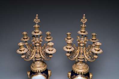 A large three-piece S&egrave;vres-style clock garniture with gilt bronze mounts, France, 19th C.