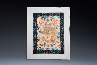 A large Chinese gold-thread-embroidered silk panel with an imperial dragon, 19th C.