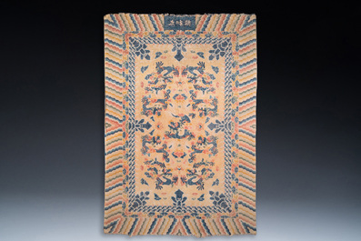 A large Chinese Ningxia rug with dragons on a yellow ground, Tai He Tian 太和殿 mark, 19th C.