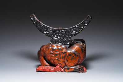 A large Chinese lacquered wooden stand in the shape of a three-legged toad, Ming