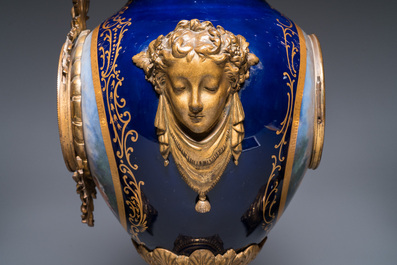 A large three-piece S&egrave;vres-style clock garniture with gilt bronze mounts, France, 19th C.