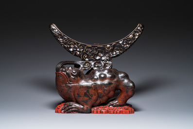 A large Chinese lacquered wooden stand in the shape of a three-legged toad, Ming