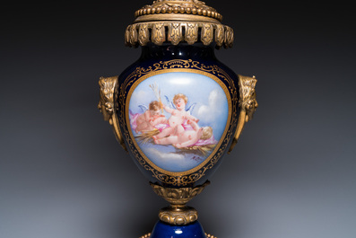 A large three-piece S&egrave;vres-style clock garniture with gilt bronze mounts, France, 19th C.