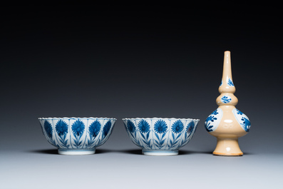 Two Chinese blue and white bowls, a small plate and a caf&eacute;-au-lait ground sprinkler, Kangxi