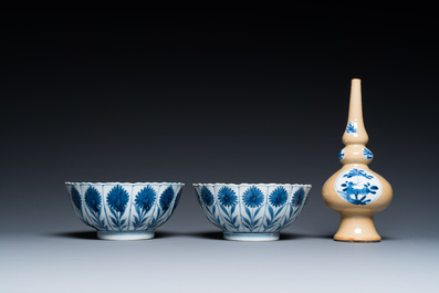Two Chinese blue and white bowls, a small plate and a caf&eacute;-au-lait ground sprinkler, Kangxi