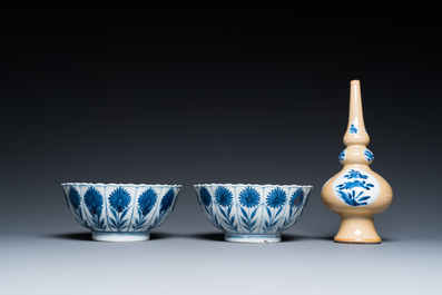 Two Chinese blue and white bowls, a small plate and a caf&eacute;-au-lait ground sprinkler, Kangxi