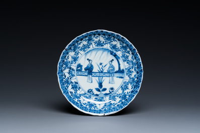 Two Chinese blue and white bowls, a small plate and a caf&eacute;-au-lait ground sprinkler, Kangxi