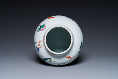 A Chinese famille rose 'playing boys' vase on a fine carved wooden stand, Yongzheng