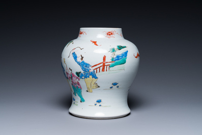 A Chinese famille rose 'playing boys' vase on a fine carved wooden stand, Yongzheng