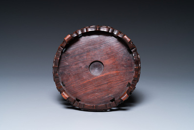 A Chinese famille rose 'playing boys' vase on a fine carved wooden stand, Yongzheng
