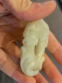 A Chinese 'twin chilong&rsquo; white jade circular pendant, Qing