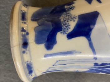 A Chinese blue and white 'two ladies and a boy' vase, Kangxi