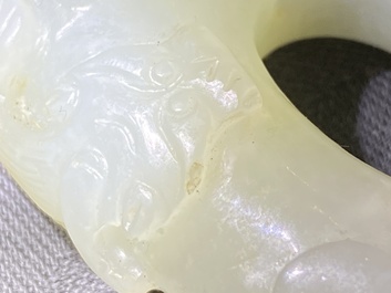 A Chinese 'twin chilong&rsquo; white jade circular pendant, Qing