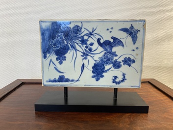A Chinese rectangular blue and white 'beheading' tile, Kangxi