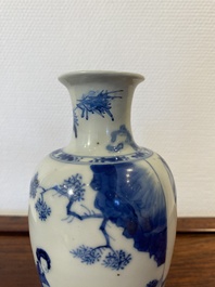A Chinese blue and white 'two ladies and a boy' vase, Kangxi