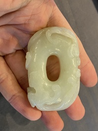 A Chinese 'twin chilong&rsquo; white jade circular pendant, Qing
