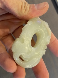 A Chinese 'twin chilong&rsquo; white jade circular pendant, Qing