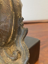 A Chinese bronze Zhen Wu with traces of red lacquer, Ming