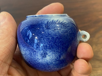 A Chinese powder-blue-glazed bird feeder with a dragon, 19th C.