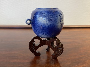 A Chinese powder-blue-glazed bird feeder with a dragon, 19th C.