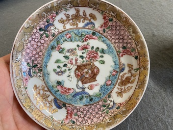 A Chinese famille rose ruby-ground cup and saucer, Yongzheng