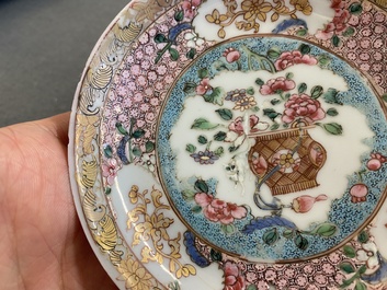 A Chinese famille rose ruby-ground cup and saucer, Yongzheng