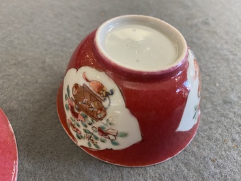 A Chinese famille rose ruby-ground cup and saucer, Yongzheng