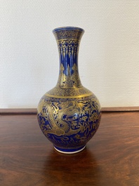 A Chinese monochrome blue gilt-decorated 'dragons' bottle vase, Qianlong mark, 19th C.