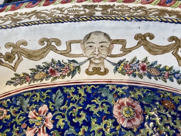 A large Chinese Canton enamel basin with garlands decorated with male heads, Qianlong