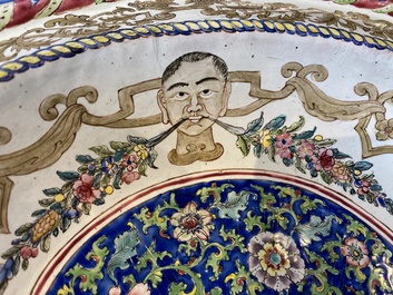 A large Chinese Canton enamel basin with garlands decorated with male heads, Qianlong