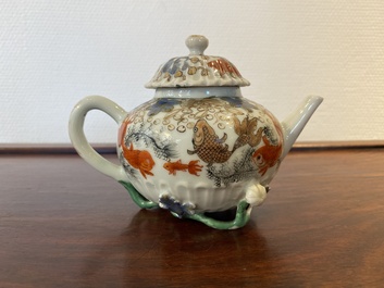 A Chinese iron-red and gilt-decorated 'carps' teapot and cover, Yongzheng