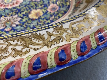 A large Chinese Canton enamel basin with garlands decorated with male heads, Qianlong