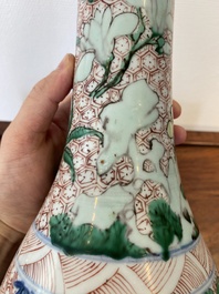 A Chinese wucai bottle vase with birds surrounded by fruits and foliage, Transitional period