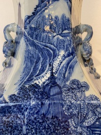 A pair of Chinese blue and white hexagonal 'mountainous landscape' vases, 19th C.