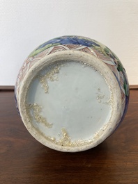 A Chinese wucai bottle vase with birds surrounded by fruits and foliage, Transitional period