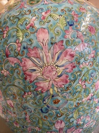 A pair of Chinese turquoise-ground famille rose vases, 19th C.