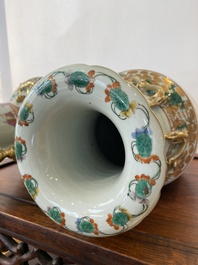 A pair of Chinese Canton famille rose 'immortals' vases, 19th C.