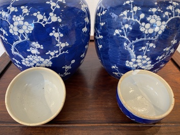 A pair of Chinese blue and white jars and covers, 19th C.