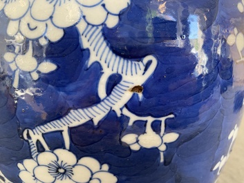 A pair of Chinese blue and white jars and covers, 19th C.