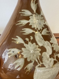 A Chinese slip-decorated brown-ground bottle vase, Zhushan kilns, late Ming