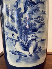 A Chinese blue-ground rouleau vase with blue and white landscape panels, 19th C.