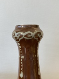 A Chinese slip-decorated brown-ground bottle vase, Zhushan kilns, late Ming